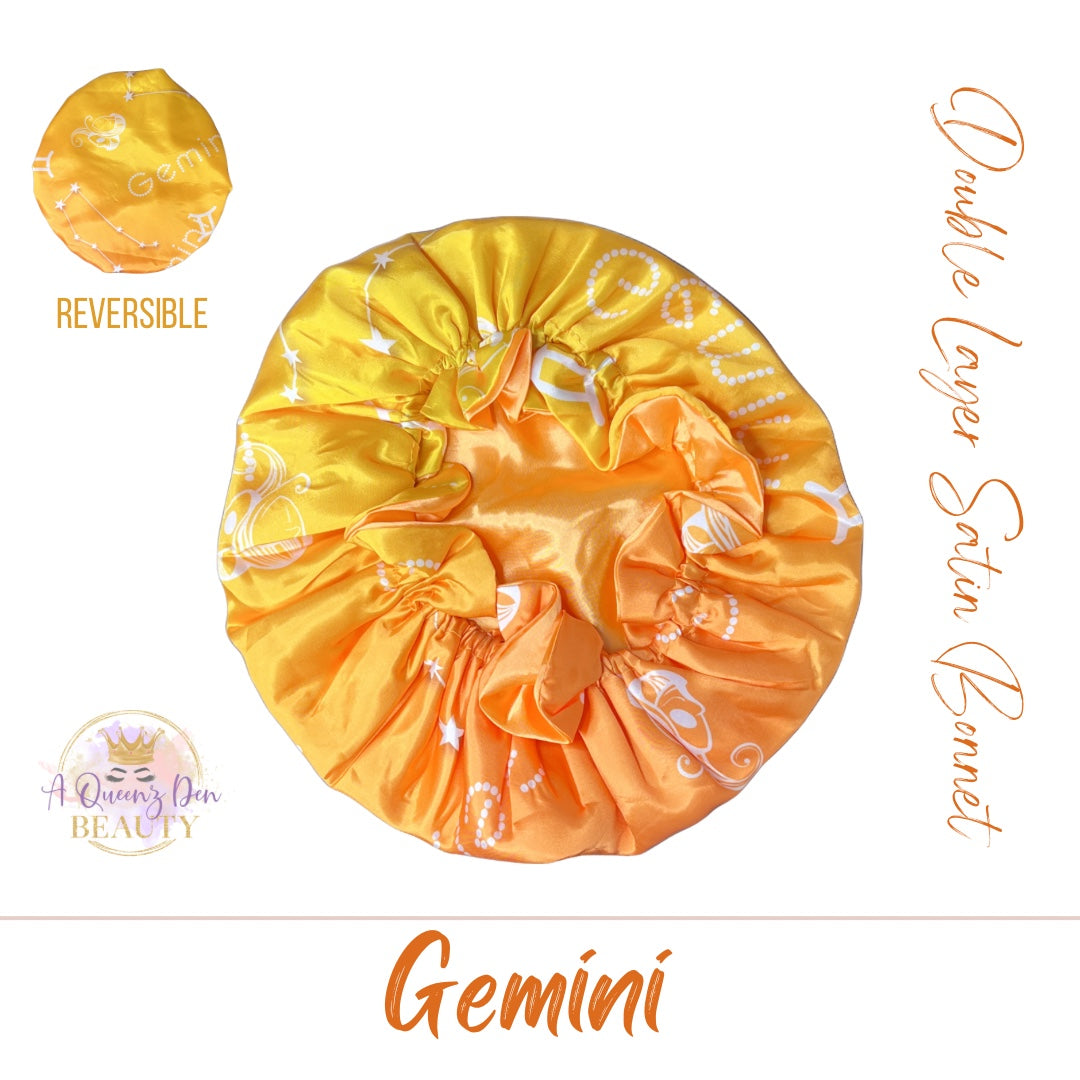 AQueenzDenHere Gemini double layer reversible satin hair bonnet in yellow and orange gradient with constellation print.