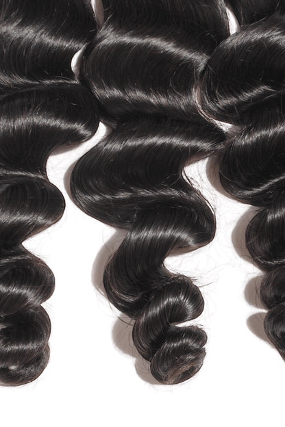 AQueenzDen black Brazilian premium virgin human hair bundles with body wave texture.
