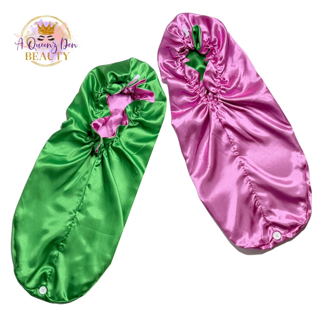 A Queenz Den double layer long satin hair bonnet in green and pink, reversible design for thick hair.