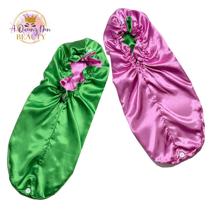 A Queenz Den double layer long satin hair bonnet in green and pink, reversible design for thick hair.