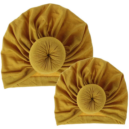 AQueenzDen Mommy and Me mustard yellow cotton top knot turbans with pre-tied knot detail.