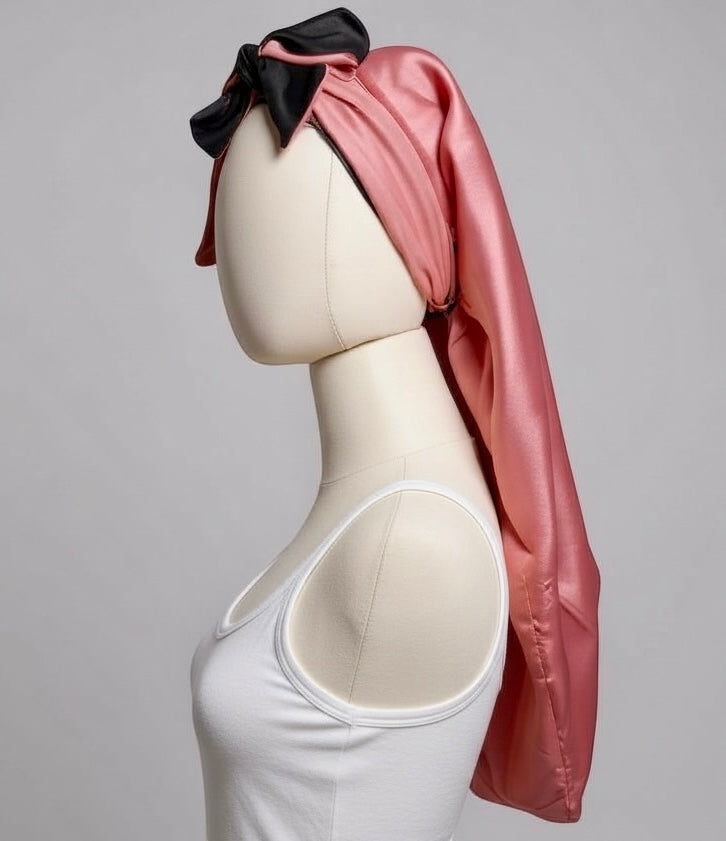AQueenzDen pink and black double layer satin bonnet with adjustable ties and bow detail. Long, silky, and reversible for women.