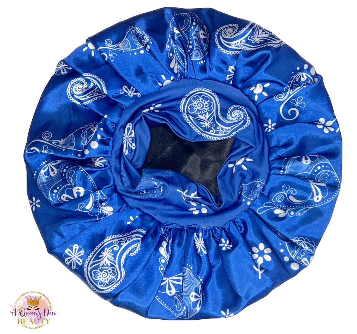 AQueenzDen Premium satin hair bonnet in blue with white paisley pattern. Features a reversible design and a zipper pocket.