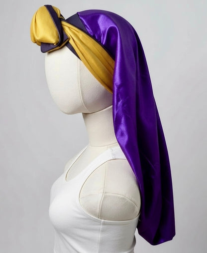 AQueenzDen purple and gold double layer satin bonnet with adjustable ties, designed for women with long hair.
