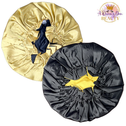 A Queenz Den adjustable double layer reversible satin bonnet in gold and black, designed for natural hair.