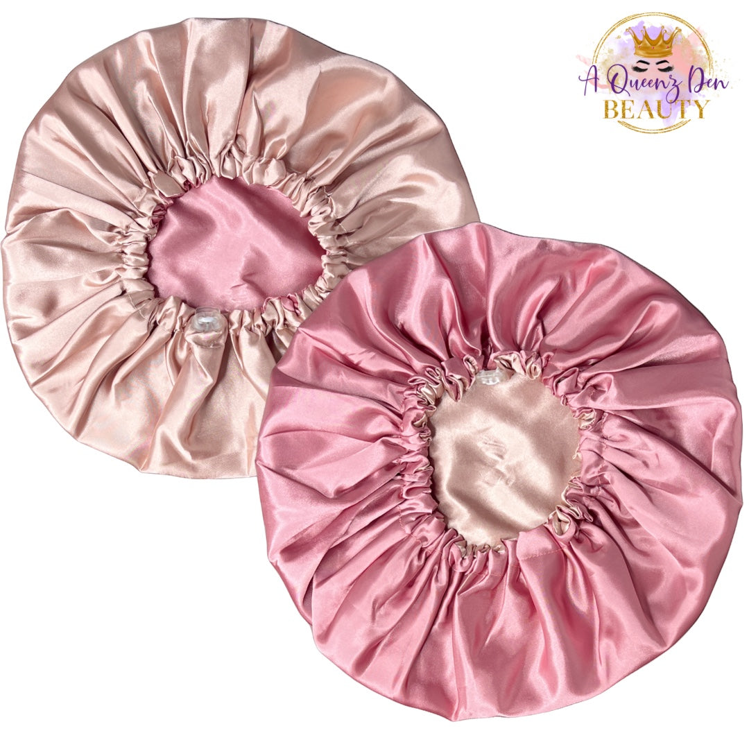 A Queenz Den adjustable double layer reversible satin bonnet in pink and champagne.