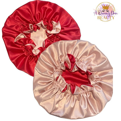 AQueenzDen reversible satin bonnet in red and champagne pink, featuring adjustable tie and double layer protection for natural hair.