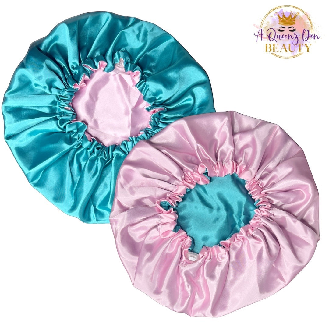 AQueenzDen reversible satin bonnet in teal and pink, adjustable double layer for natural hair.