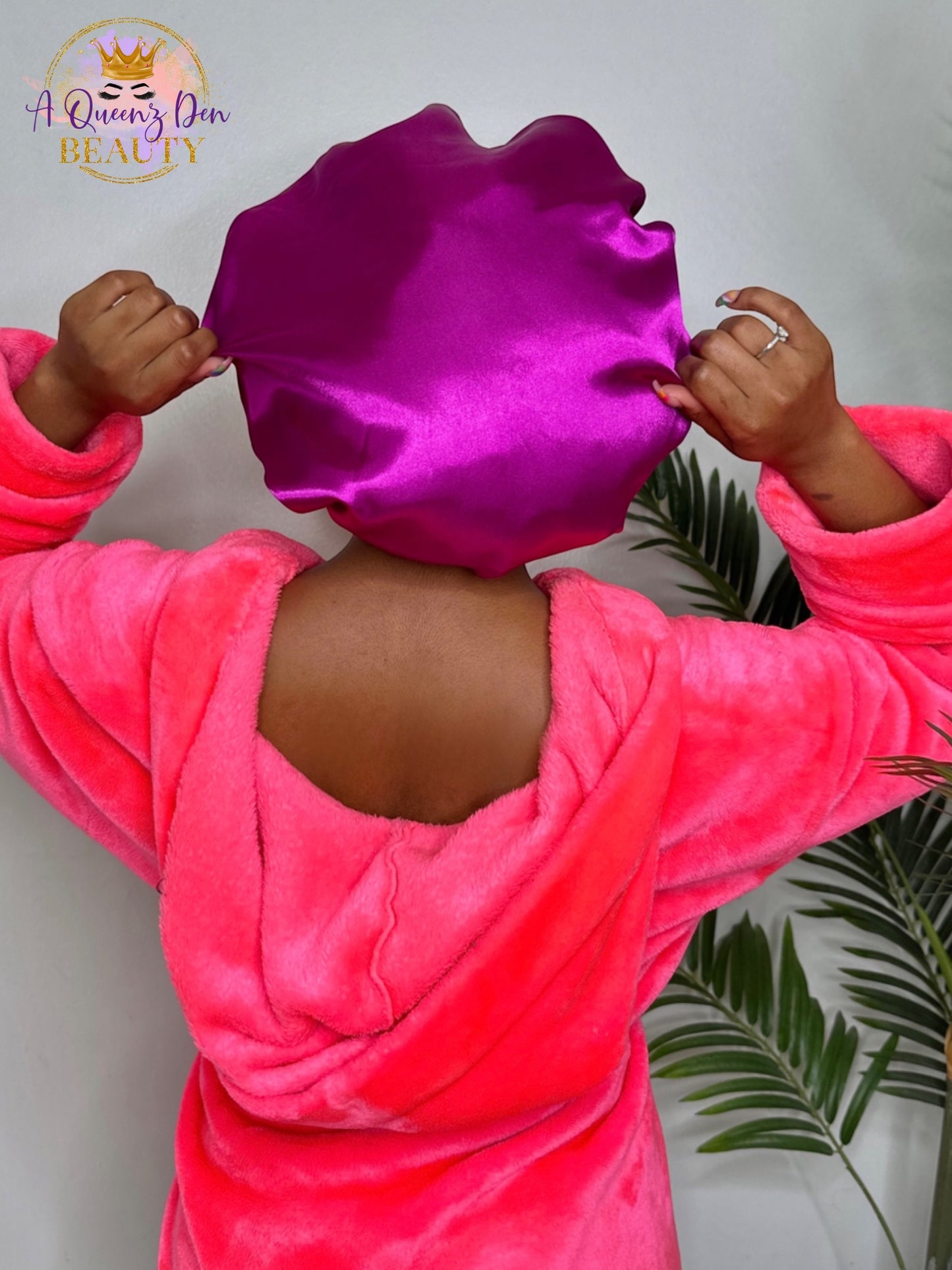 AQueenzDen adjustable tie satin bonnet in vibrant magenta, double-layered for hair protection. One size fits all.