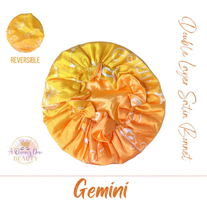 AQueenzDenHere Gemini double layer reversible satin hair bonnet in yellow and orange gradient with constellation print.
