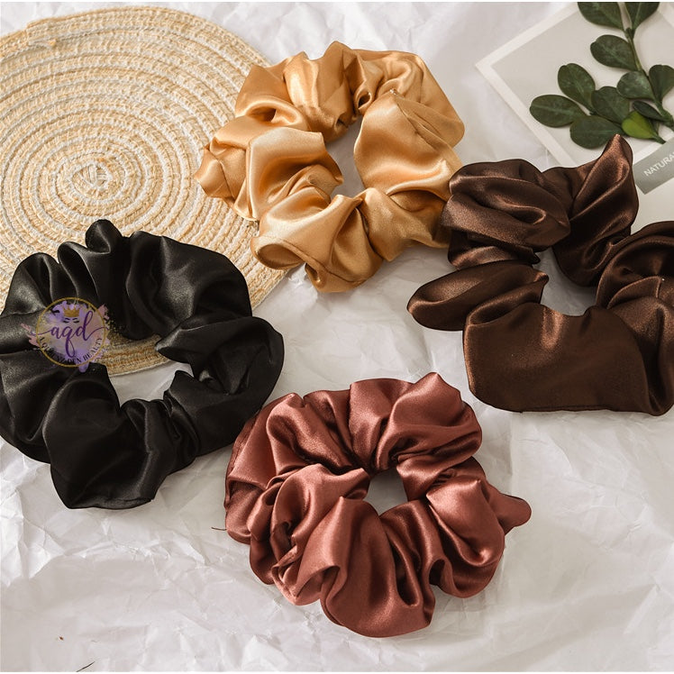 AQueenzDenHere medium satin hair scrunchies in black, gold, brown, and rose gold.