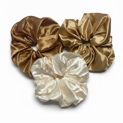 AQueenzDenHere medium satin scrunchies in champagne, gold, and bronze. Soft, silky hair ties.